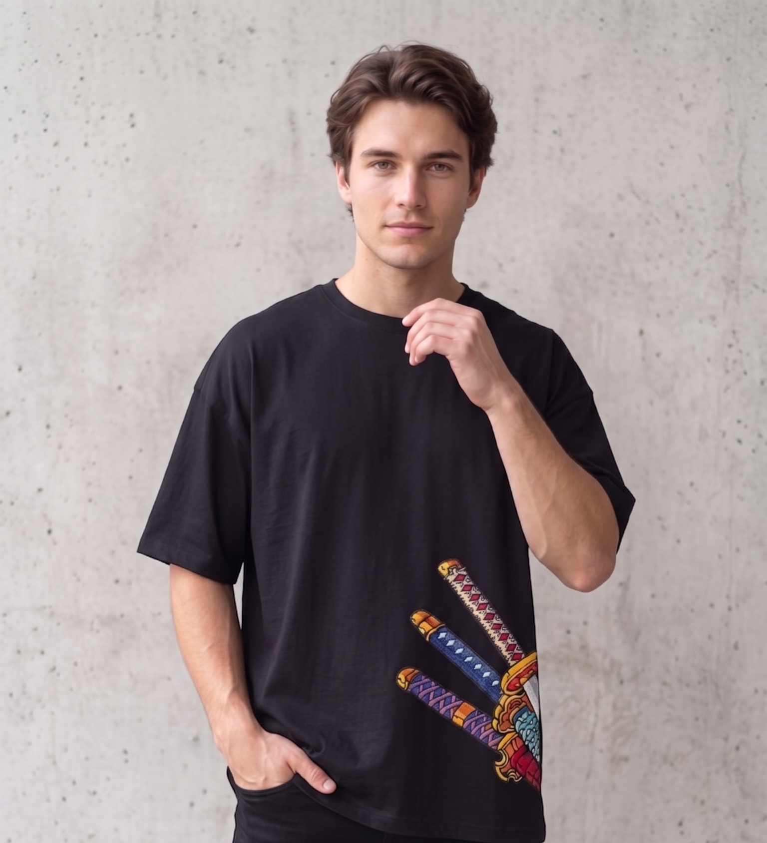 A male model wearing a premium off-white oversized t-shirt featuring three detailed katana hilts in high-density direct embroidery on the lower side