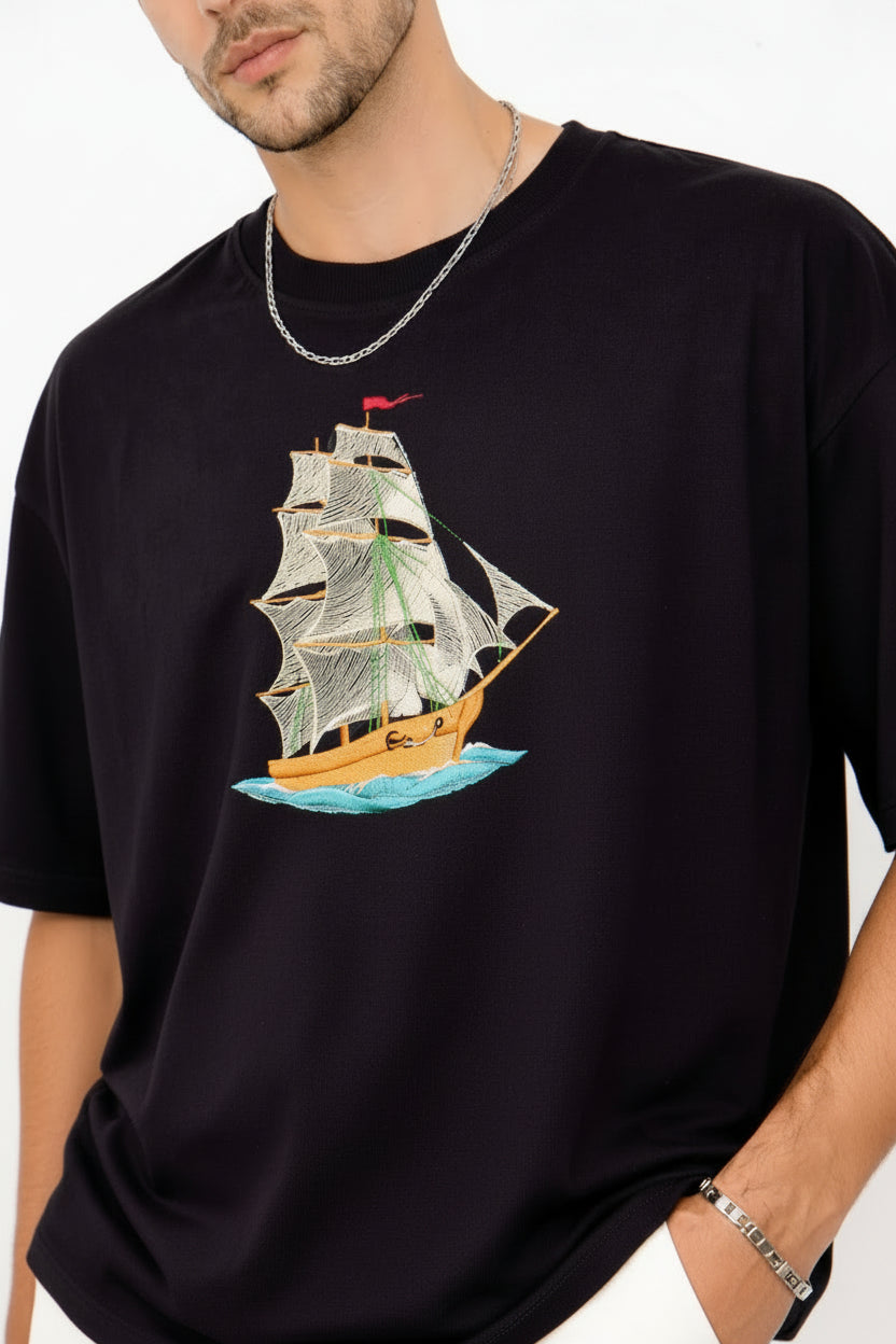 "Anetoonz premium oversized black streetwear T-shirt for men with half sleeves and a custom nautical ship embroidery design."