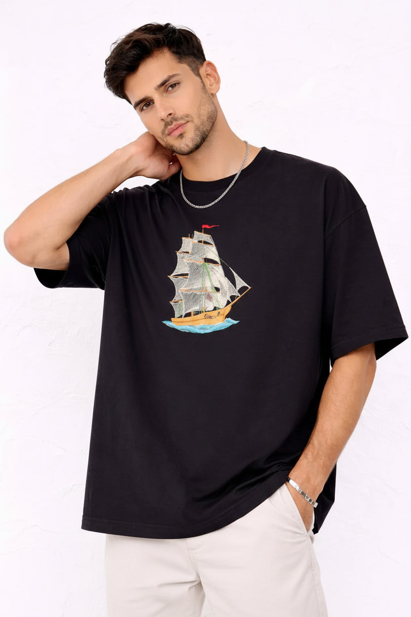 
"Anetoonz premium oversized black streetwear T-shirt for men with half sleeves and a custom nautical ship embroidery design."