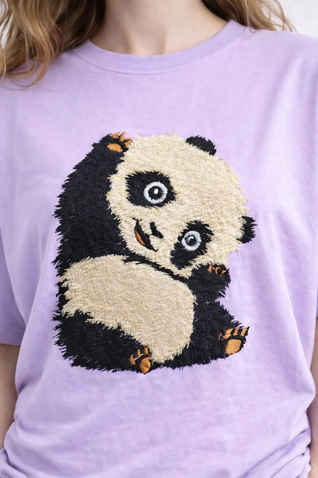 "Anetoonz light purple oversized streetwear T-shirt for women featuring custom panda embroidery and half sleeves."