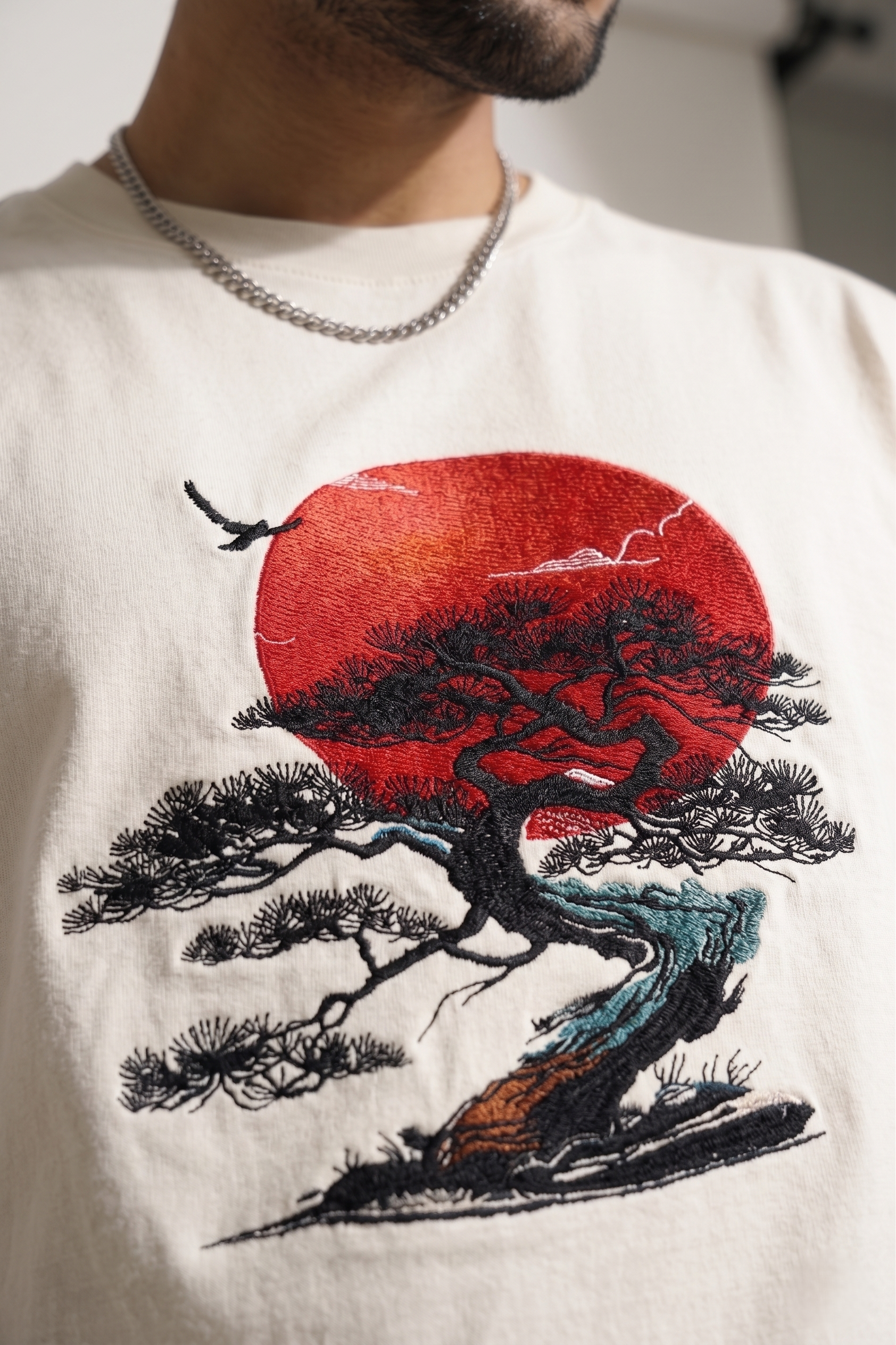 
"Anetoonz premium off-white oversized T-shirt for men with half sleeves and a custom  bonsai tree embroidery design."