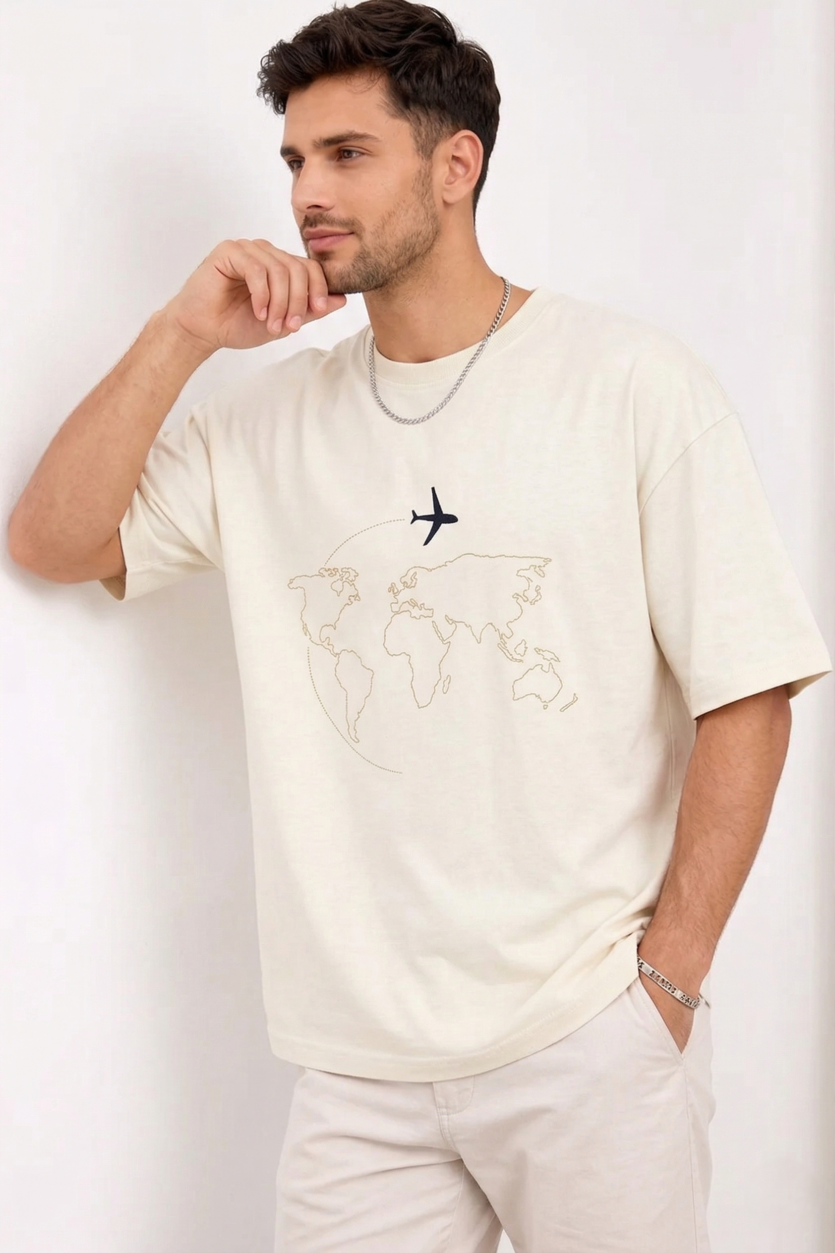 "Anetoonz premium off-white oversized streetwear T-shirt for men with half sleeves and custom travel-themed world map embroidery."