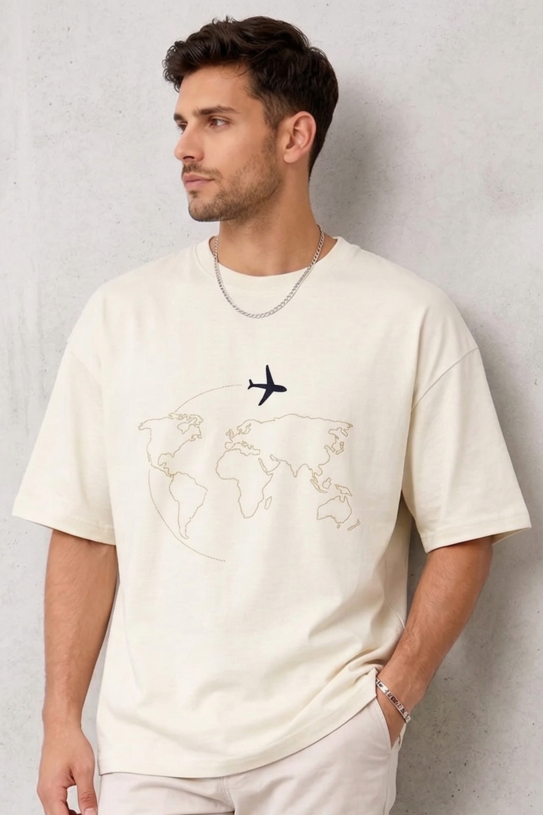 "Anetoonz premium off-white oversized streetwear T-shirt for men with half sleeves and custom travel-themed world map embroidery."