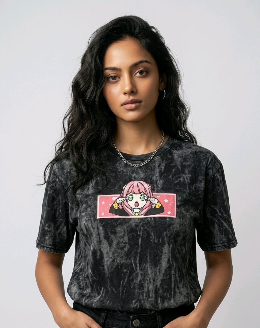 Fashion e-commerce shot of an Indian model in an acid-wash streetwear t-shirt with custom anime embroidery and a silver chain necklace.