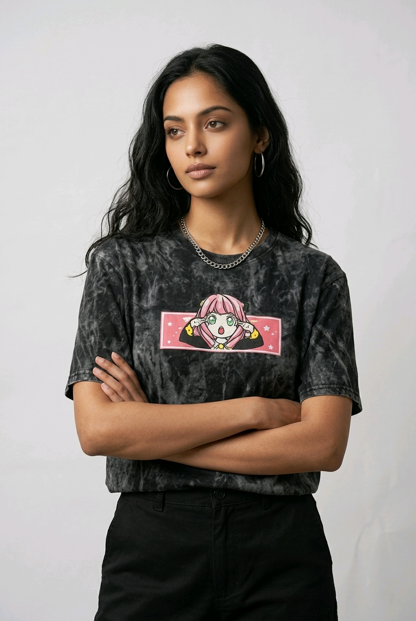 Fashion e-commerce shot of an Indian model in an acid-wash streetwear t-shirt with custom anime embroidery and a silver chain necklace.