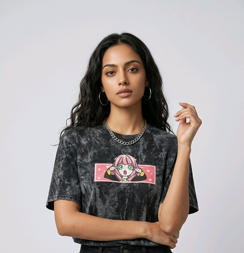 Fashion e-commerce shot of an Indian model in an acid-wash streetwear t-shirt with custom anime embroidery and a silver chain necklace.