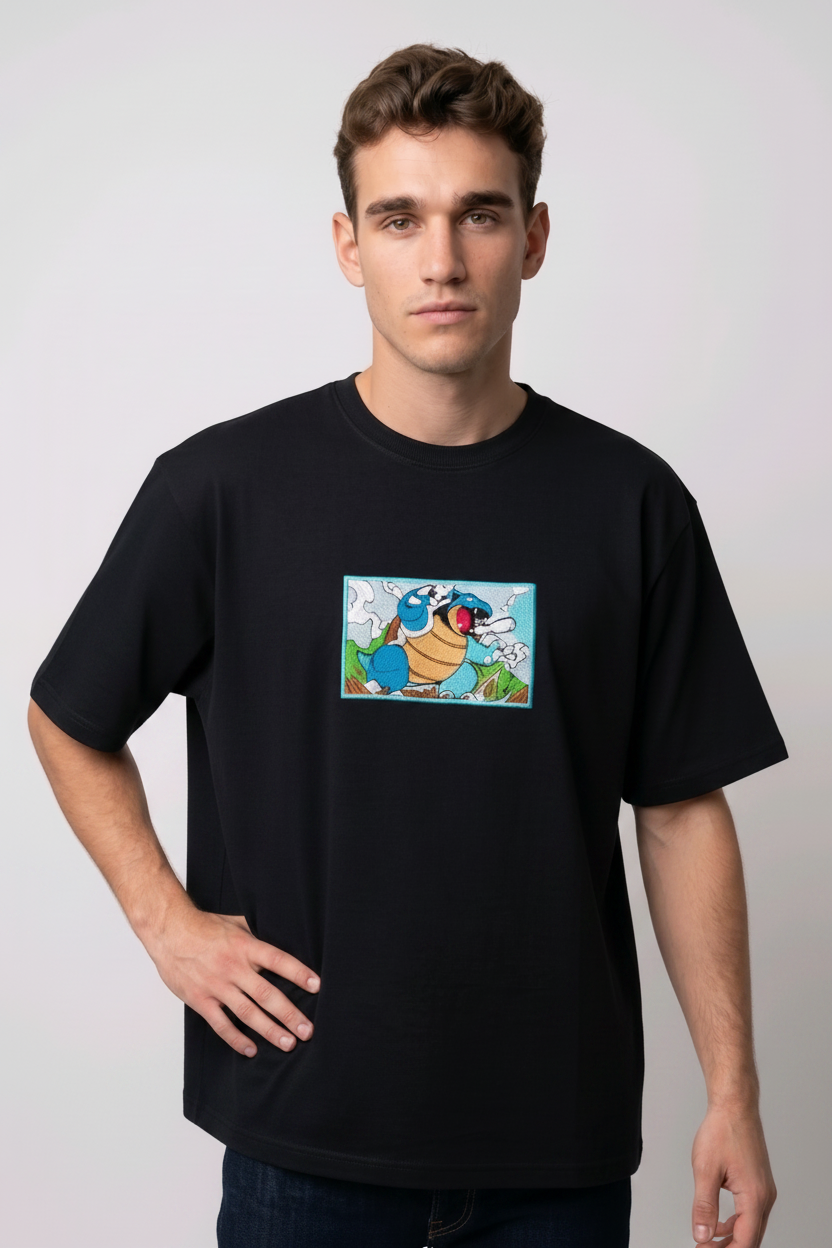 Front view of a black heavyweight T-shirt showcasing a high-quality embroidered scene of the Pokémon Blastoise.