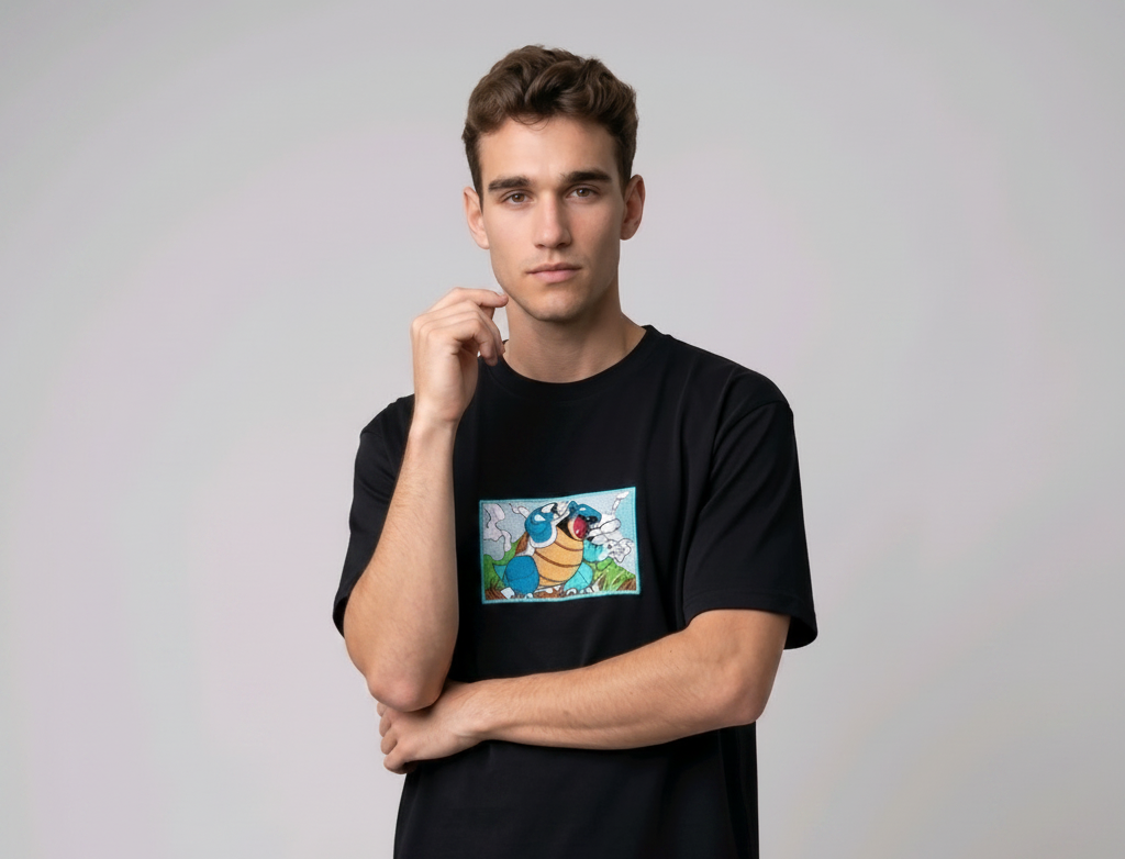Front view of a black heavyweight T-shirt showcasing a high-quality embroidered scene of the Pokémon Blastoise.