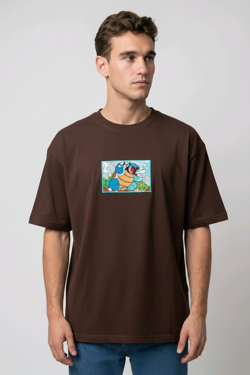 Front view of a brown heavyweight T-shirt showcasing a high-quality embroidered scene of the Pokémon Blastoise.
