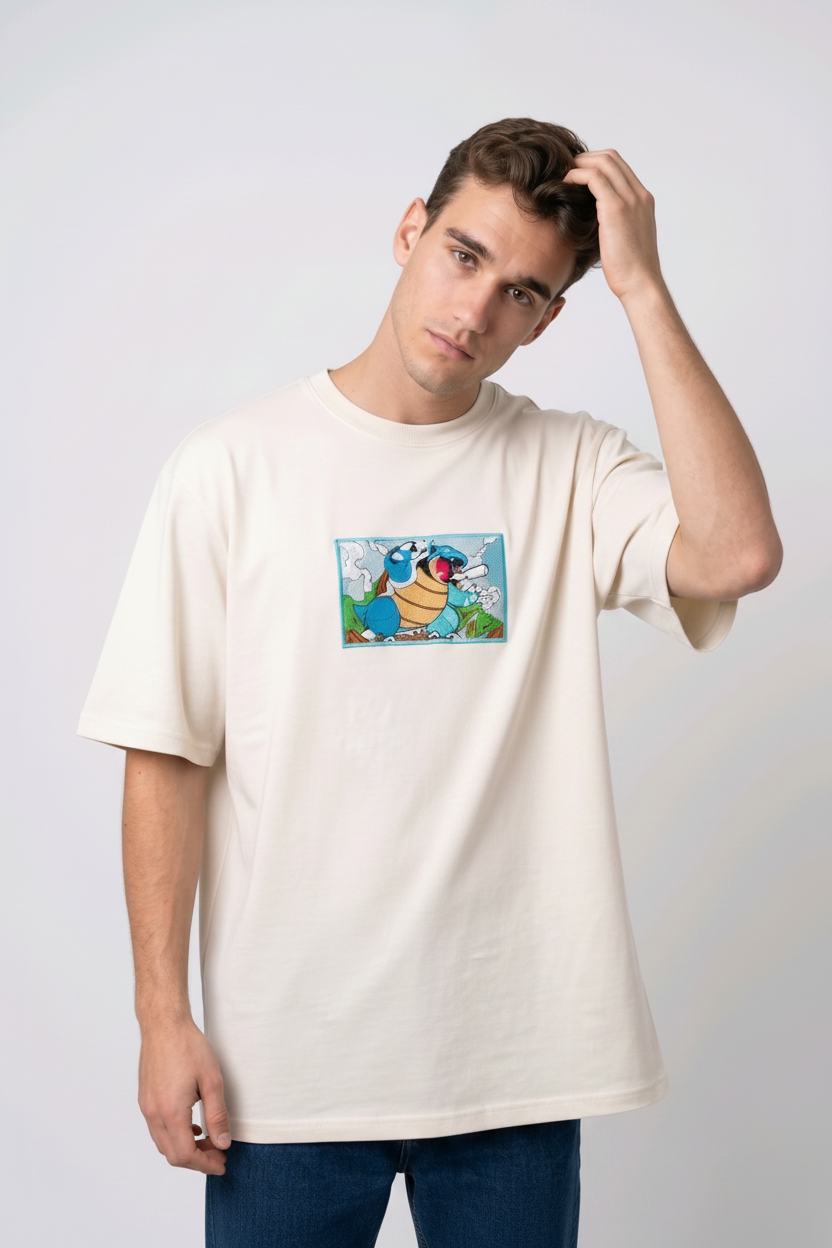 Front view of a off white heavyweight T-shirt showcasing a high-quality embroidered scene of the Pokémon Blastoise.