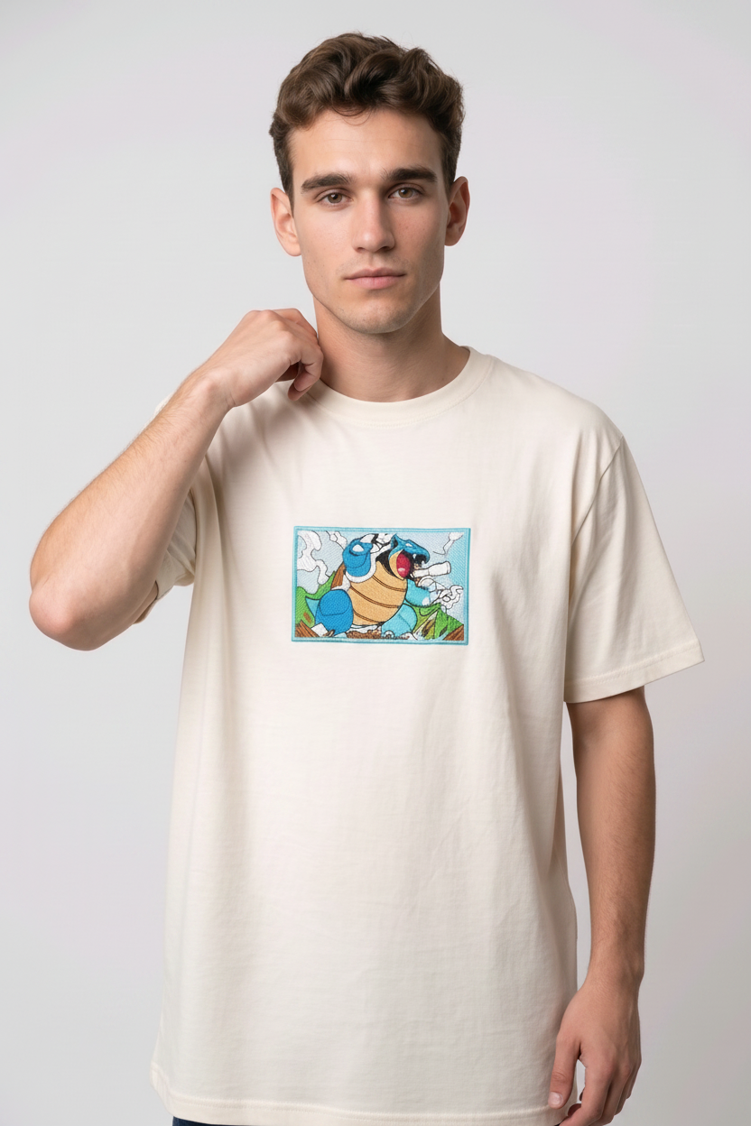 Front view of a off white heavyweight T-shirt showcasing a high-quality embroidered scene of the Pokémon Blastoise.