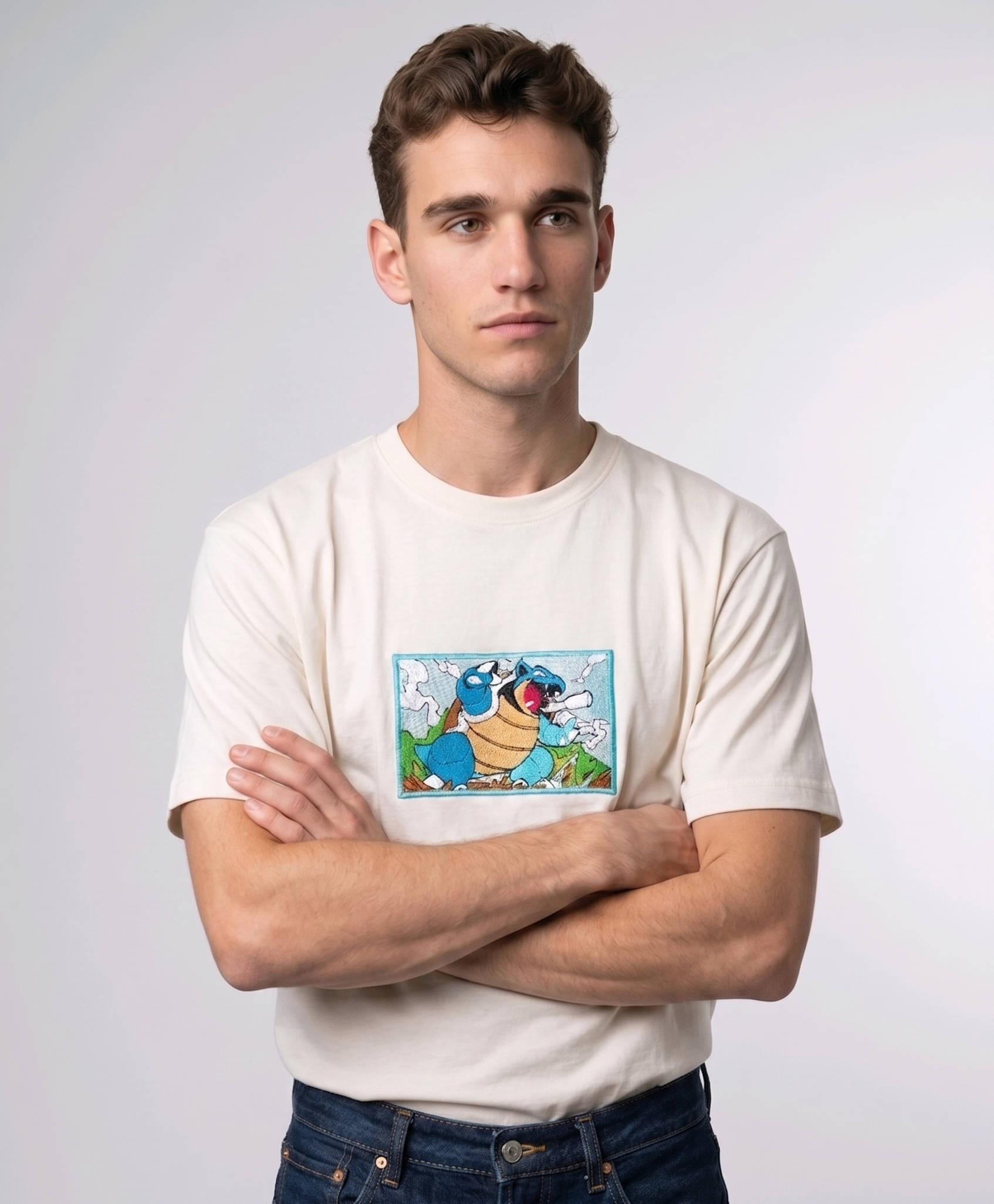 Front view of a off white heavyweight T-shirt showcasing a high-quality embroidered scene of the Pokémon Blastoise.