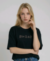 wearing an oversized, half-sleeved heavyweight cotton t-shirt. The chest features high-density direct embroidery of five minimalist coffee-themed icons in a horizontal row, including a French press, coffee beans, a coffee bag, a steaming cup, and a moka pot.
