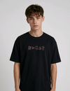 wearing an oversized, half-sleeved heavyweight cotton t-shirt. The chest features high-density direct embroidery of five minimalist coffee-themed icons in a horizontal row, including a French press, coffee beans, a coffee bag, a steaming cup, and a moka pot.
