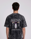 A male model from the back, wearing a Acid wash oversized t-shirt with a large, detailed embroidery design.

