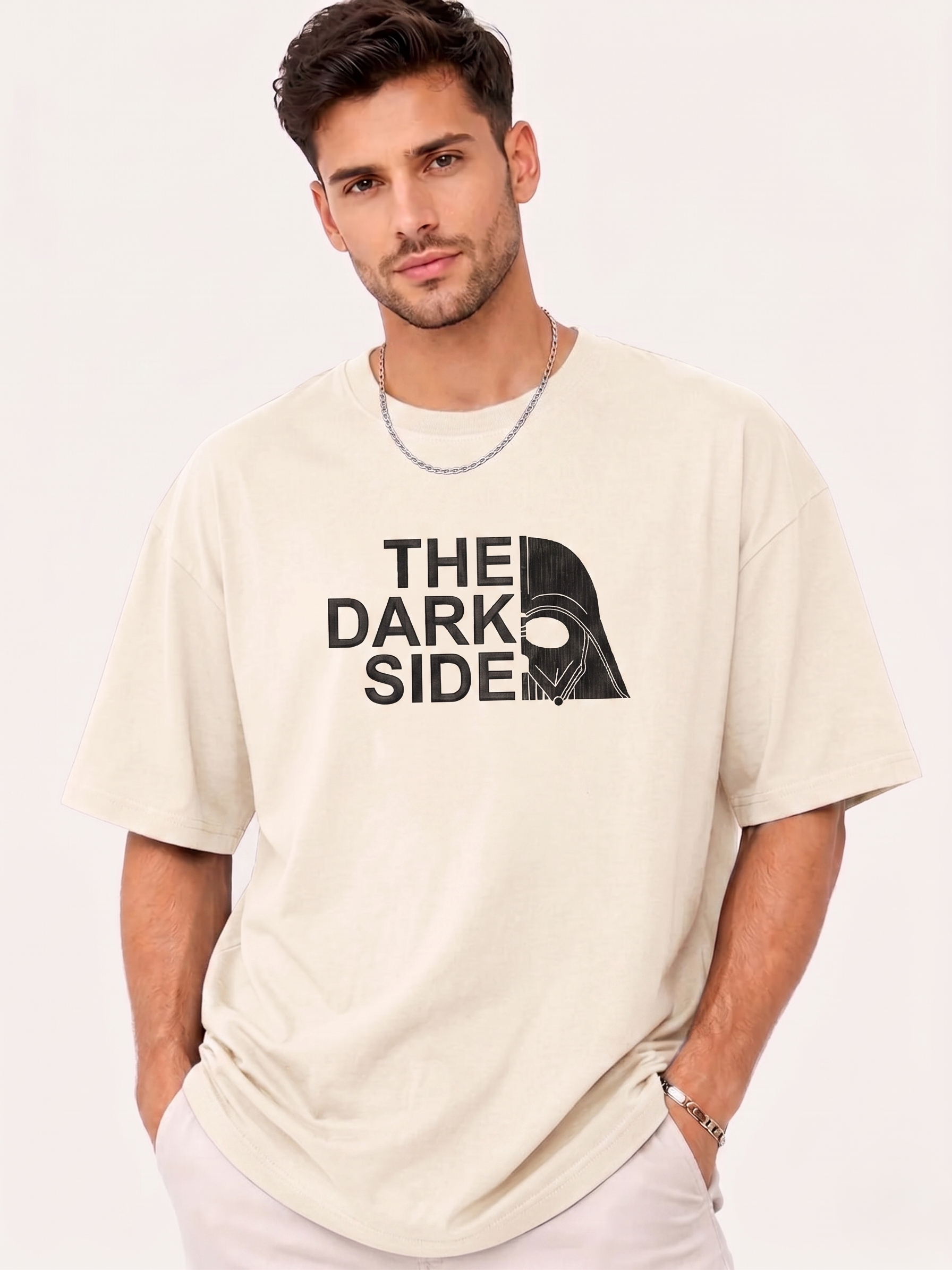 Man wearing beige T-shirt with "The Dark Side" text and split Darth Vader helmet graphic.