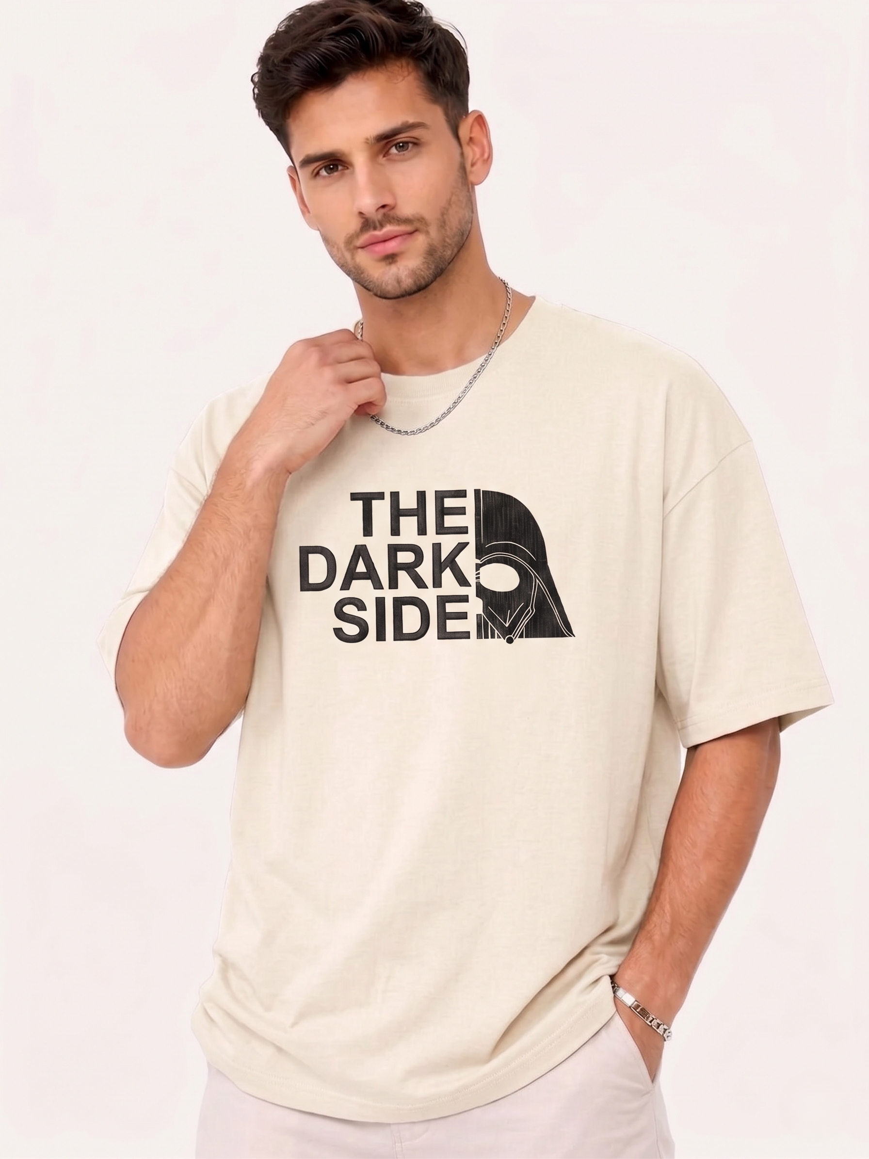 Man wearing beige T-shirt with "The Dark Side" text and split Darth Vader helmet graphic.