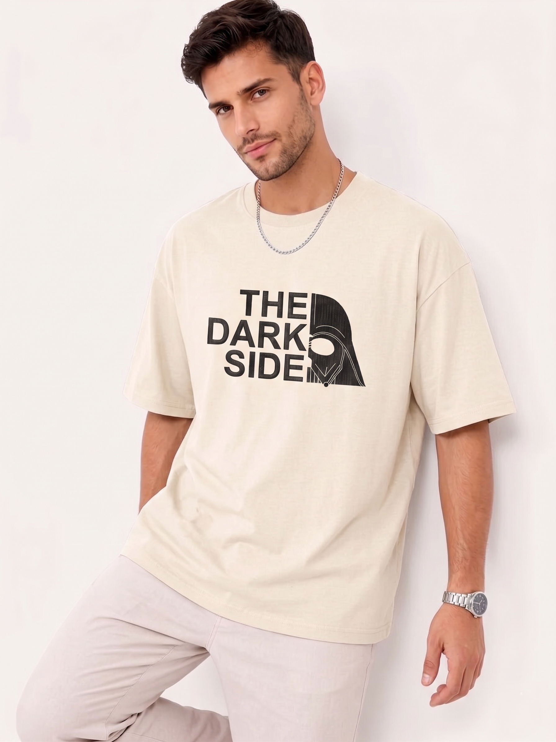 Man wearing beige T-shirt with "The Dark Side" text and split Darth Vader helmet graphic.