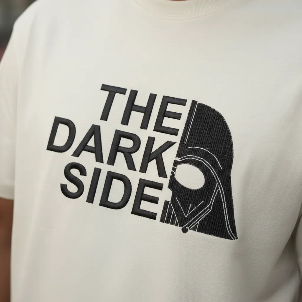 Man wearing beige T-shirt with "The Dark Side" text and split Darth Vader helmet graphic.