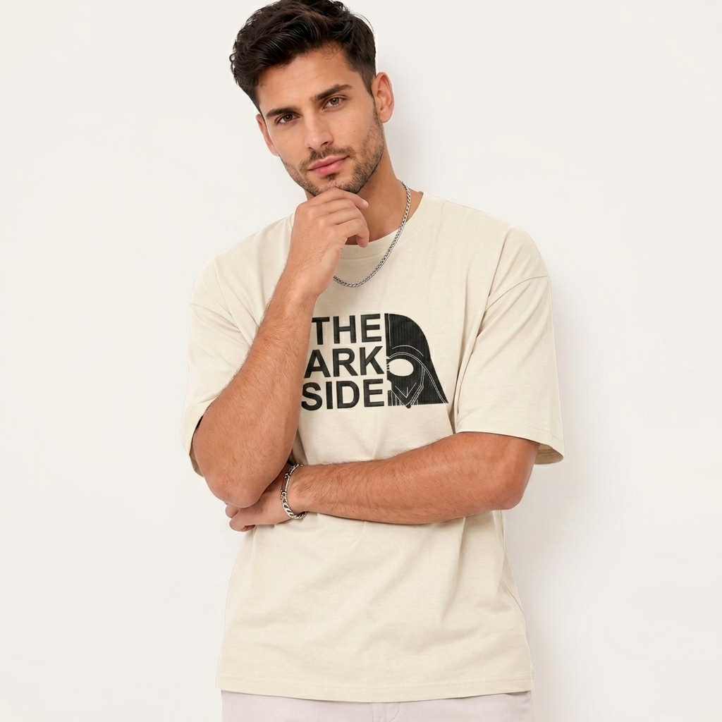 Man wearing beige T-shirt with "The Dark Side" text and split Darth Vader helmet graphic.