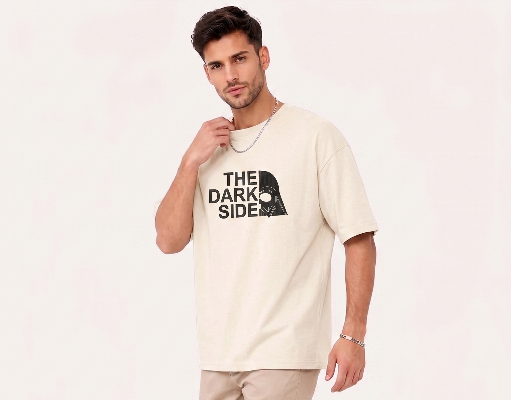 Man wearing beige T-shirt with "The Dark Side" text and split Darth Vader helmet graphic.