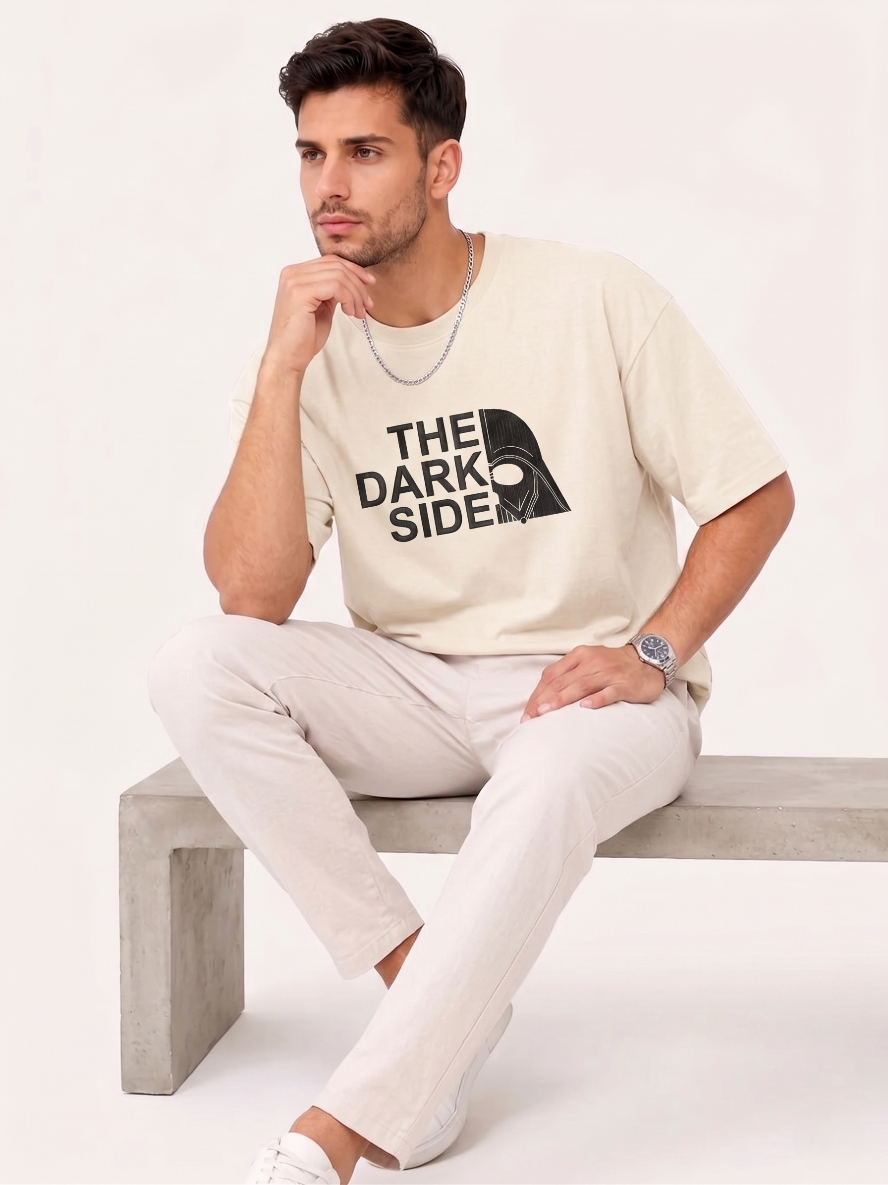 Man wearing beige T-shirt with "The Dark Side" text and split Darth Vader helmet graphic.