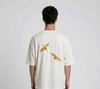 Rear view of a person wearing a heavyweight oversized half-sleeved t-shirt featuring high-density direct embroidery of two golden cranes on the back.

