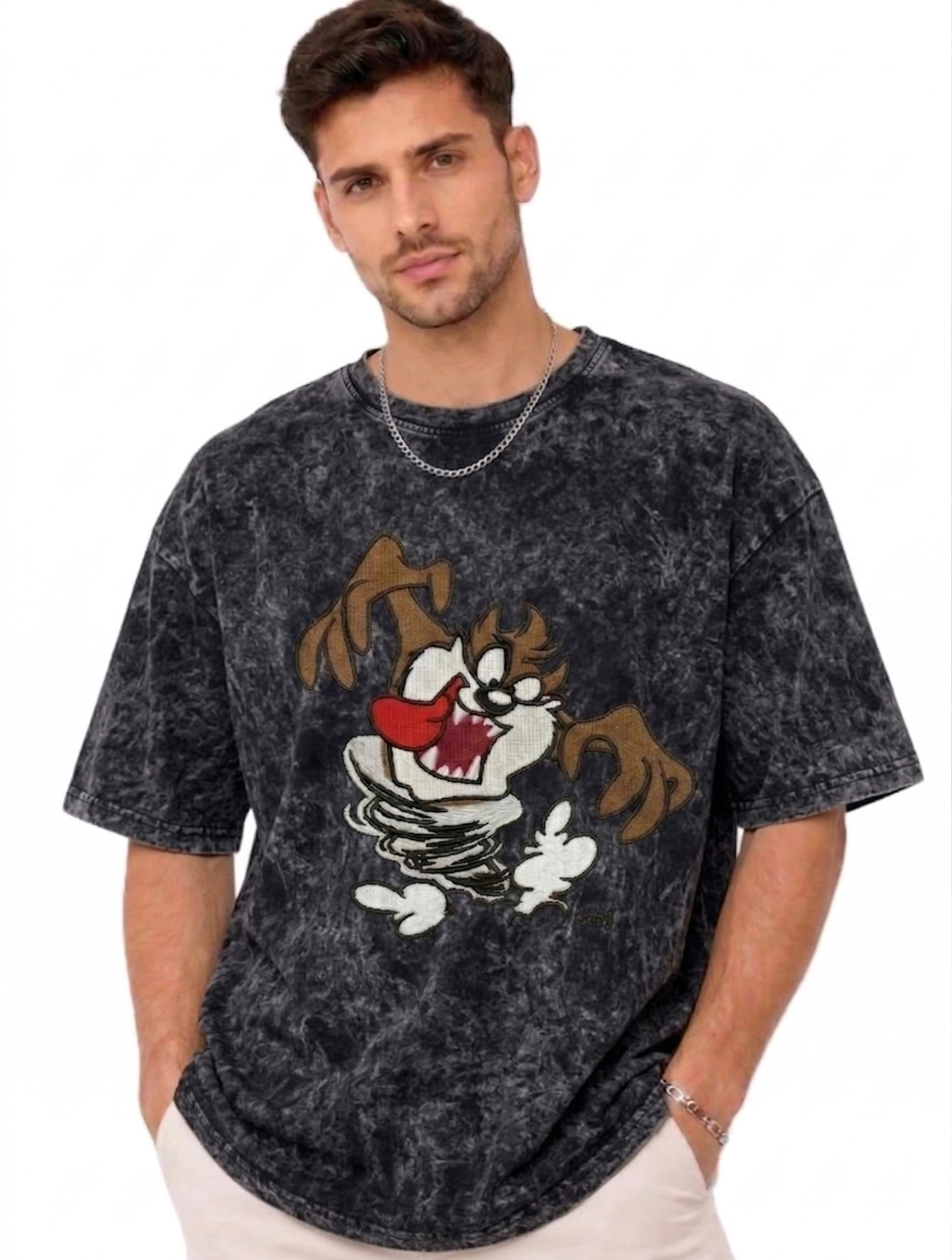 E-commerce product photo of a premium acid-wash streetwear t-shirt with custom character embroidery and a relaxed, oversized fit.
