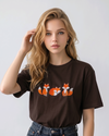 E-commerce model shot of a premium dark brown streetwear t-shirt with detailed animal embroidery and a relaxed fit.
