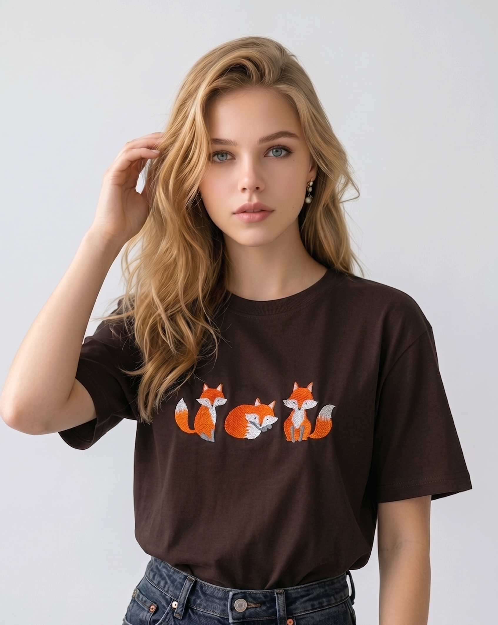 E-commerce model shot of a premium dark brown streetwear t-shirt with detailed animal embroidery and a relaxed fit.