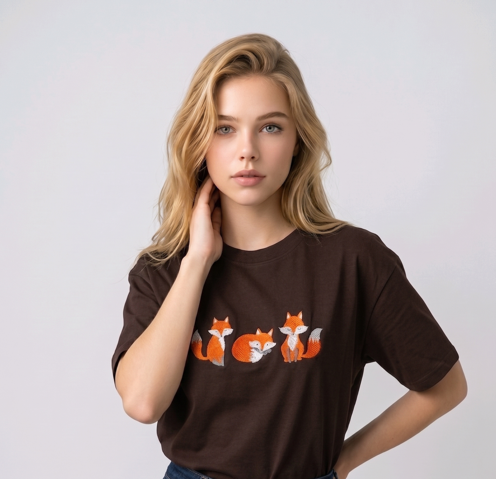 E-commerce model shot of a premium dark brown streetwear t-shirt with detailed animal embroidery and a relaxed fit.