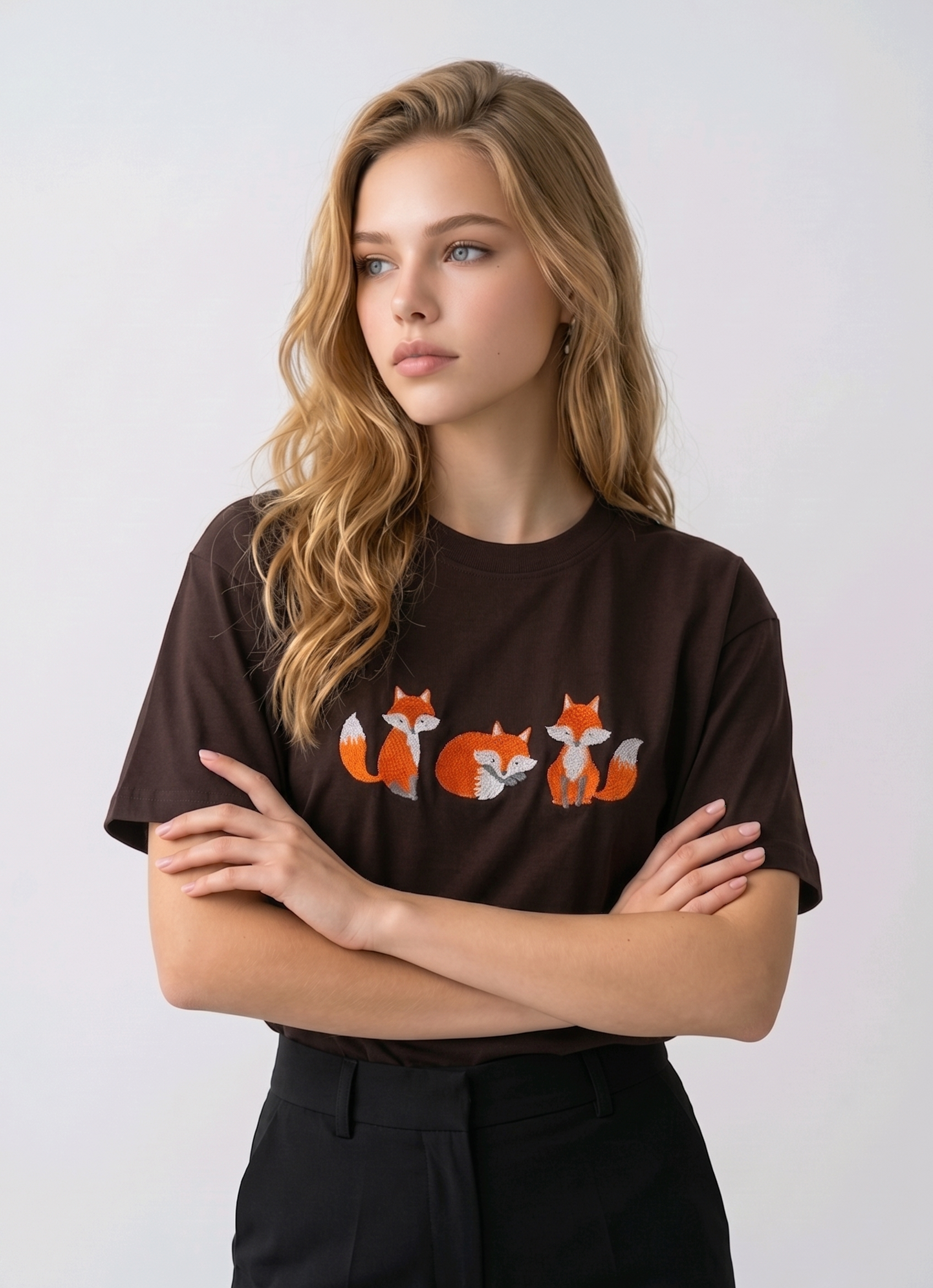 E-commerce model shot of a premium dark brown streetwear t-shirt with detailed animal embroidery and a relaxed fit.