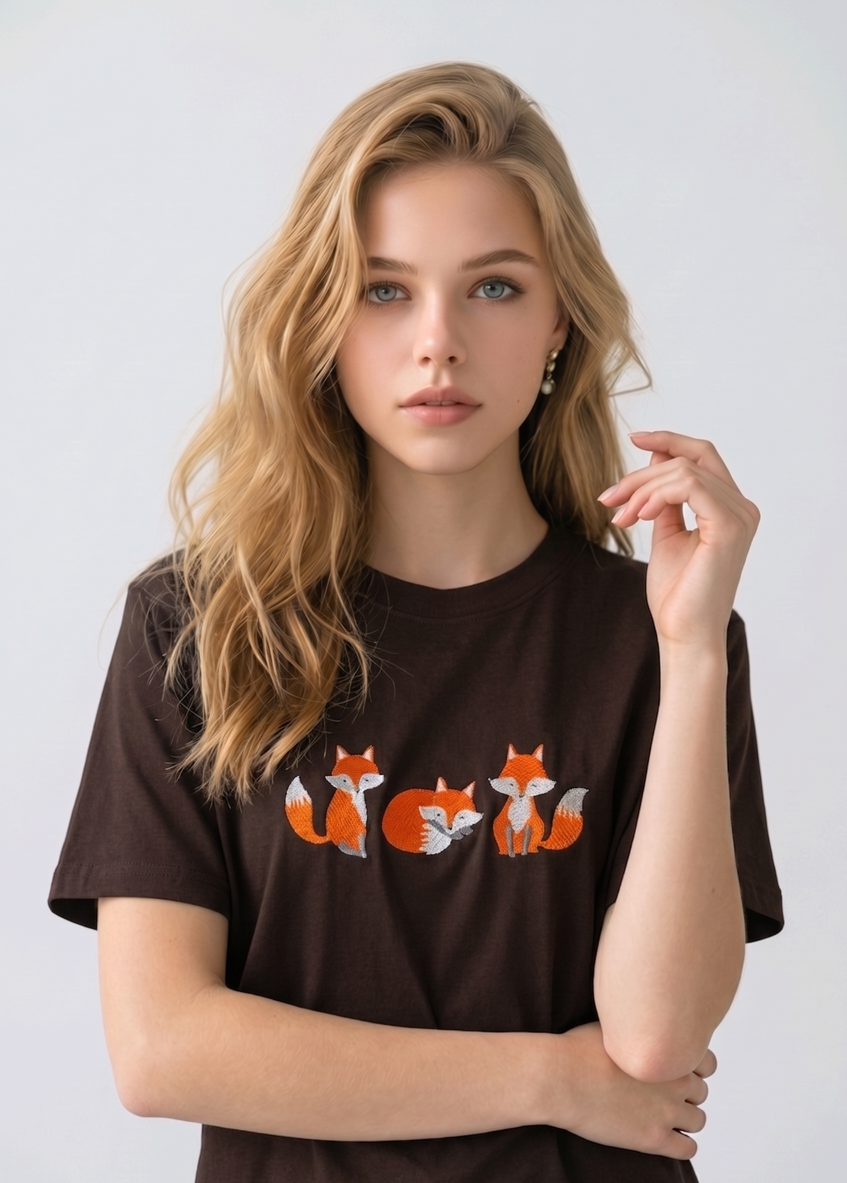 E-commerce model shot of a premium dark brown streetwear t-shirt with detailed animal embroidery and a relaxed fit.