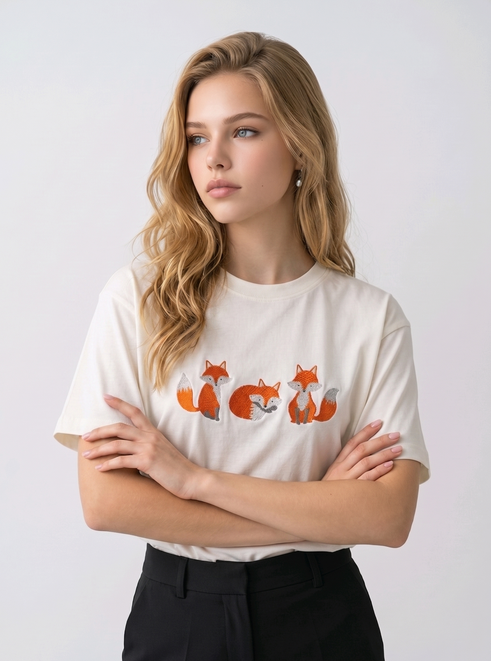 E-commerce model shot of a premium off white streetwear t-shirt with detailed animal embroidery and a relaxed fit.